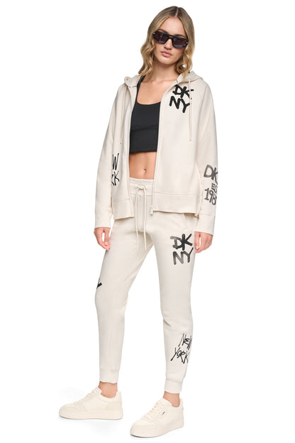MID-RISE GRAFFITI RHINESTONE LOGO JOGGER - Eggnog | DKNY